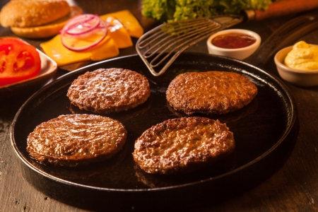 four hamburger patties