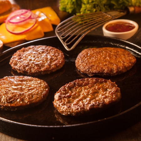 four hamburger patties